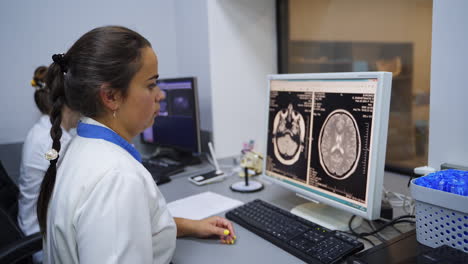 medical professionals reviewing ct scan images