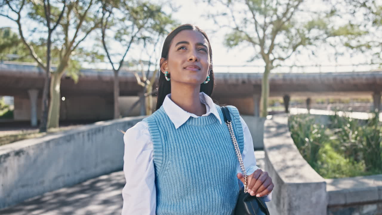 Stylish woman walking in an urban environment