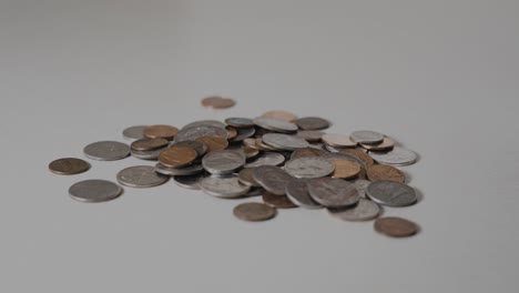 A-still-look-at-a-small-pile-of-coins-on-a-table