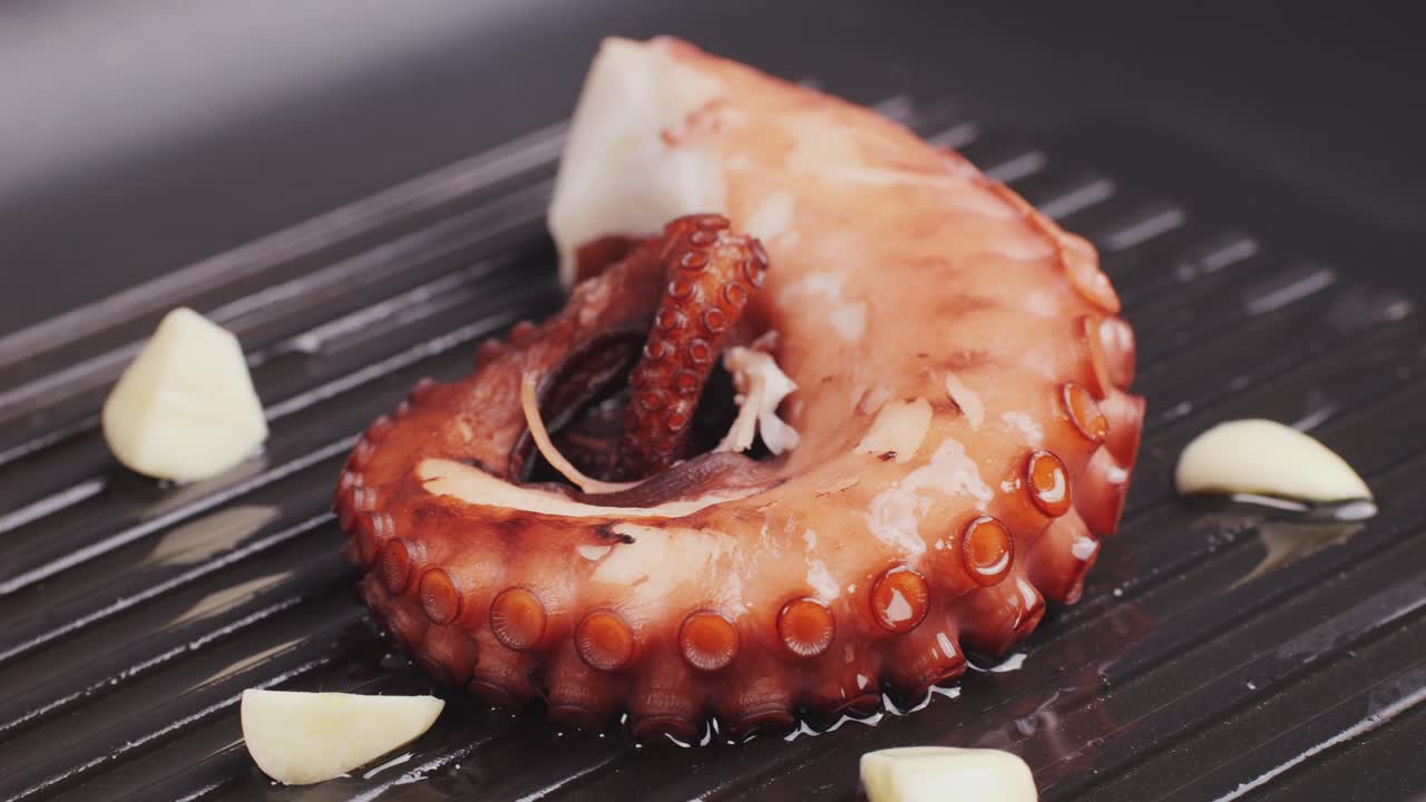 Octopus cooking, chef grill fresh octopus galician style on restaurant kitchen, healthy food, seafood cafe in spain, traditional asian japanese spanish and mediterranean dish.