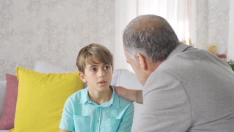 Curious-little-girl-listening-to-her-grandfather.