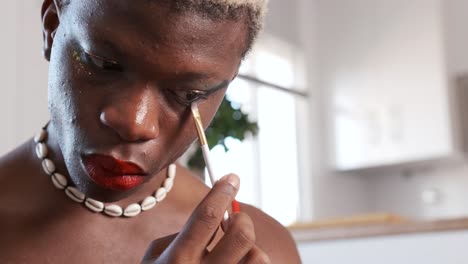 close-up of a person applying eye makeup with a brush