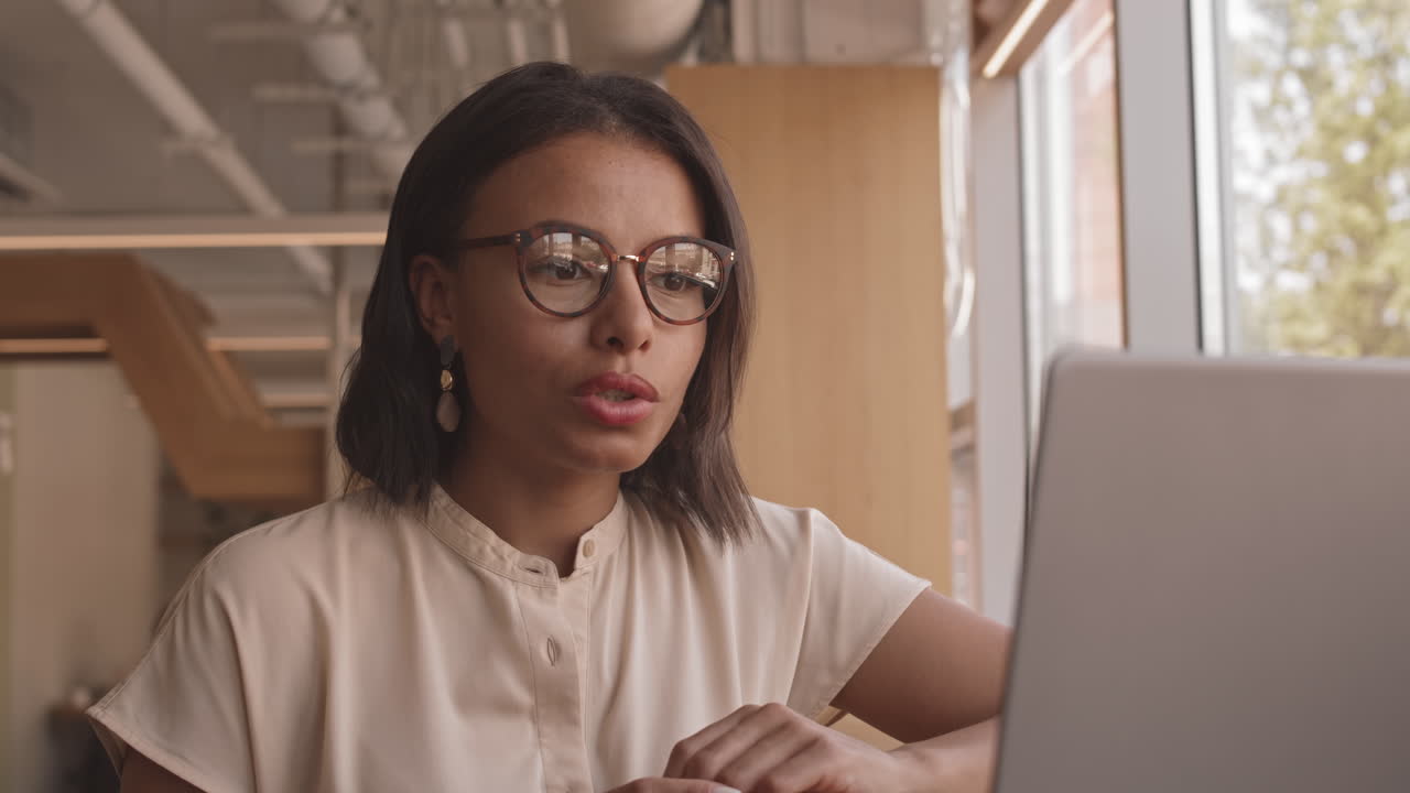 Freelancer Video Calling in Coffee Shop