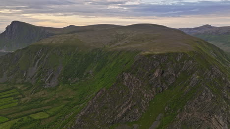 Stave-Norway-Aerial-v4-norwegian-scenic-vie,-fly-along-rocky-mountainside-reveals-small-coastal-village-overlooking-at-endless-horizon-of-north-atlantic-ocean---Shot-with-Mavic-3-Cine---June-2022