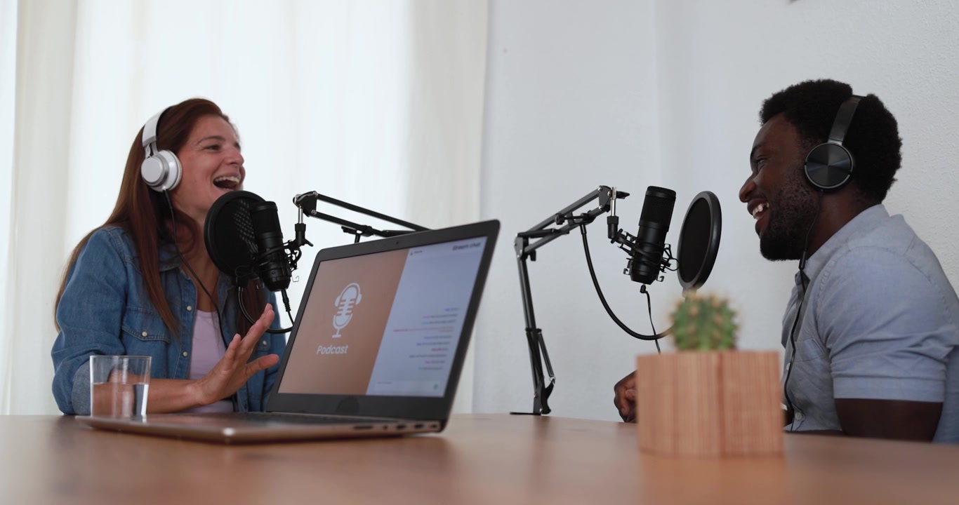 Two People Recording a Podcast in a Studio