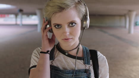 portrait of young woman wearing headphones listening to music cute alternative grunge