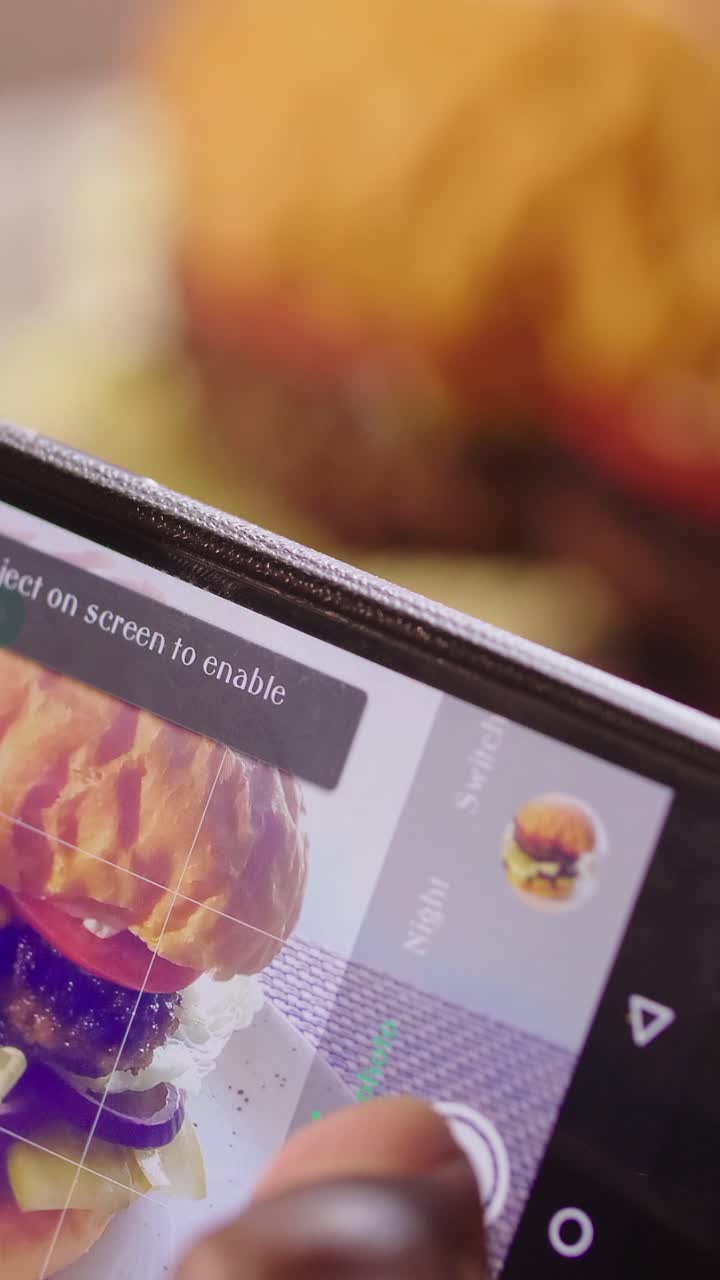 Taking a photo of a delicious burger