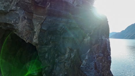 Downward-aerial-reveal-of-decommisioned-railway-tunnel-at-Hetteneset-in-Stanghelle,-Norway