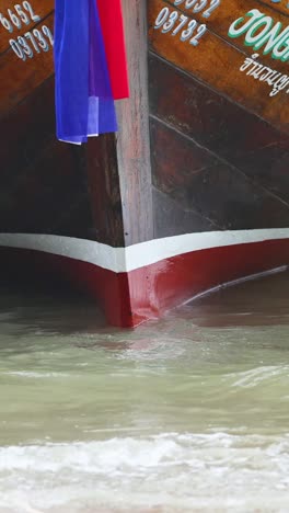 boat approaching shore in krabi, thailand