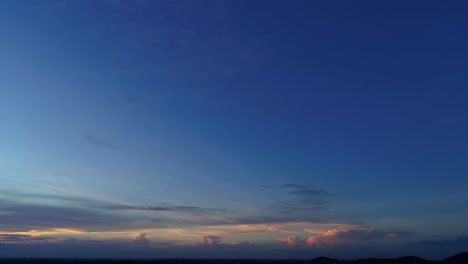 aerial footage for blue hour during sunset revealing city lights and a highway