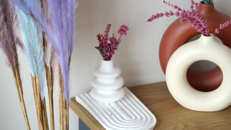 modern vase arrangement on wooden table