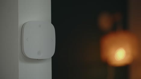 Person-Turns-On-Light-By-Pushing-Button-On-Smart-Switch-At-Home