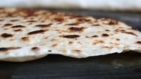 cooking flatbread on a pan