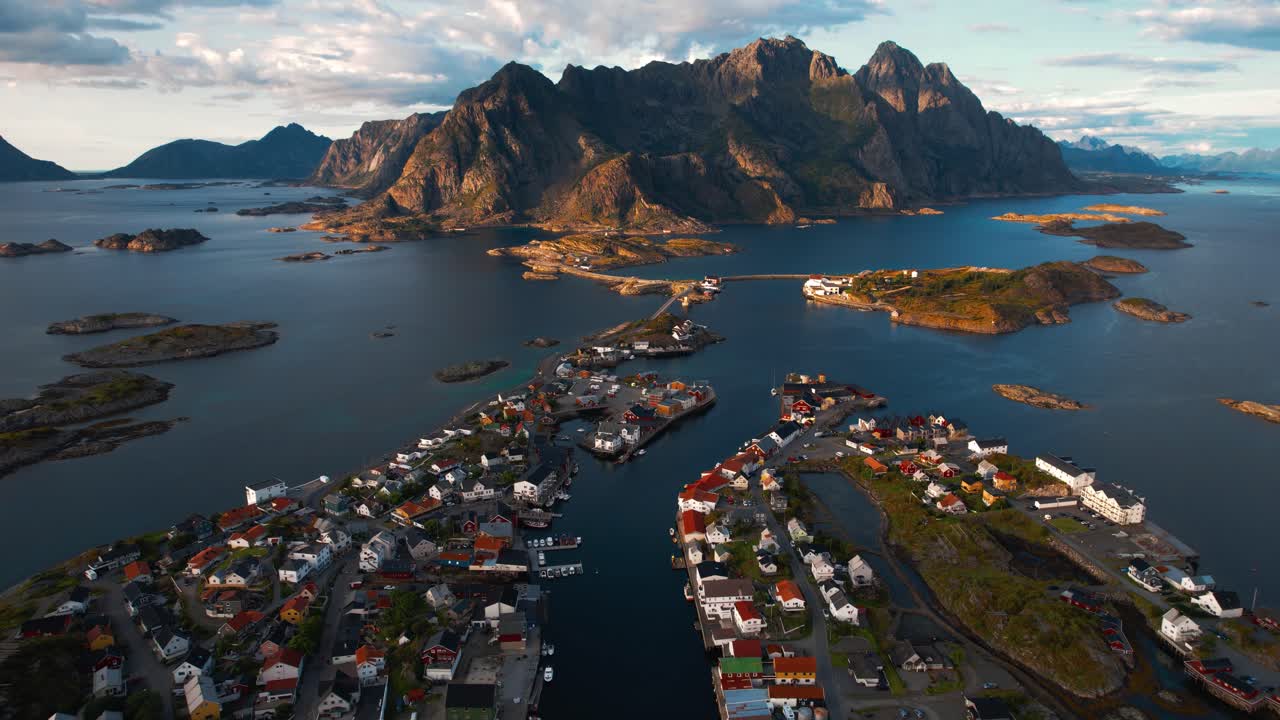 Aerial panorama of scenic Henningsvaer town, harbor, and surrounding arctic seascape. Lofoten, Norway.