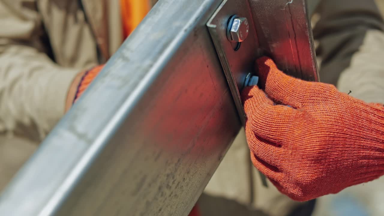 Solar panel construction worker. Close up of worker installing solar panels frame