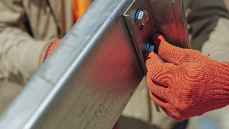 solar panel construction worker. close up of worker installing solar panels frame