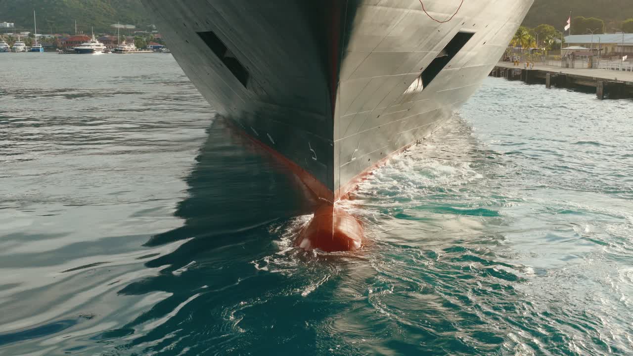 Large Ship's Bulbous Bow Cutting Through Water, Underwater Vessel's Hull. Close-up Shot