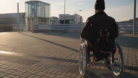 man in wheelchair outdoors