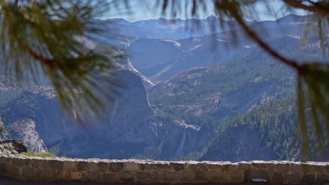 footage showing nevada falls waterfall viewed from the elevated glacier point in yosemite national park, california. liberty cap dome is also visible.