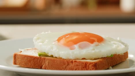 fried egg on toast with avocado