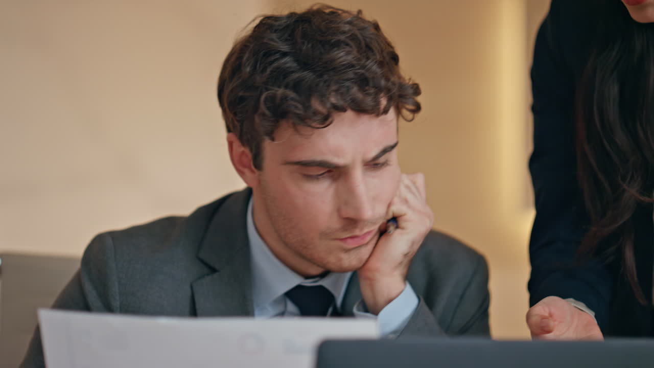Worried couple working together feeling nervous having deadline at buro closeup