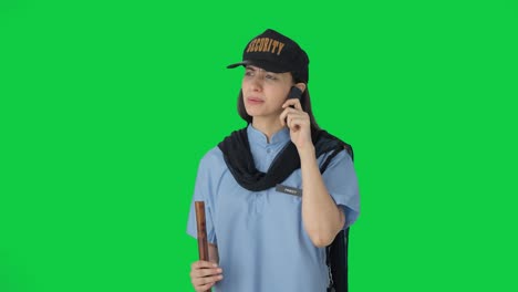Angry-Indian-female-security-guard-fighting-with-someone-on-call-Green-screen