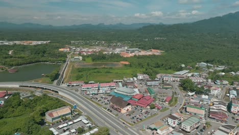 aerial drone view, serian district town ,summer with beautiful green trees,new building and water park lake, water from the mountain sarawak,borneo.