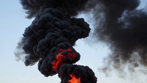 large fire with dense black smoke