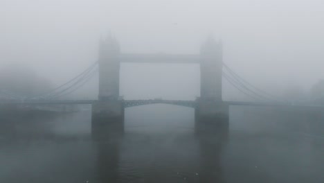 tower bridge with fog, london, uk
cold freezing fog day in winter with bad weather, skyline, st paul's cathedral, the city thames river, modern old, united kingdom, morning fog