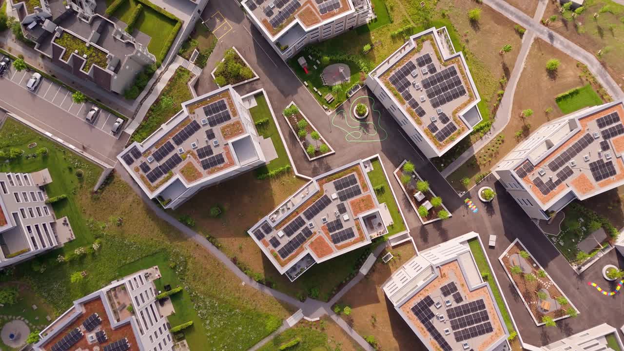 Modern Swiss buildings with solar roofs in Wil, St. Gallen, seen from above