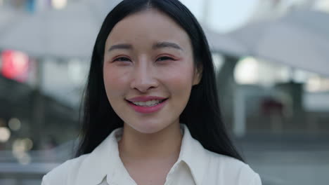 close-up portrait of a smiling young asian woman