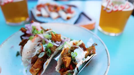 delicious tacos and beer on a table