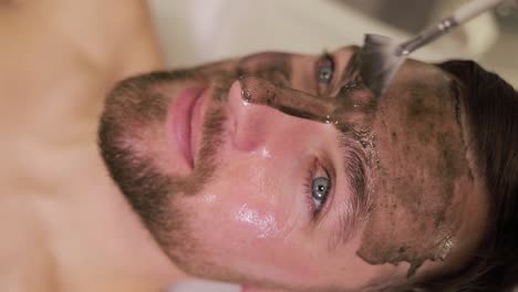 man with a facial mask