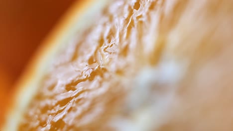 extreme close-up focus shift over freshly cut orange