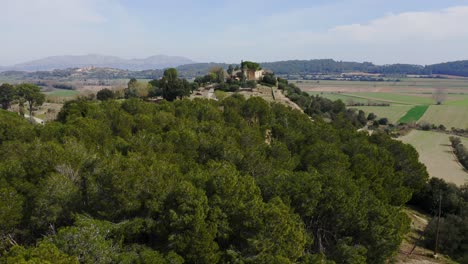 drone shot of a colossal archeological museum in the small town of ullastret,catalonia