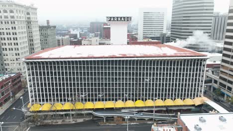 aerial shot pushing in towards a parking garage in spokane, washington