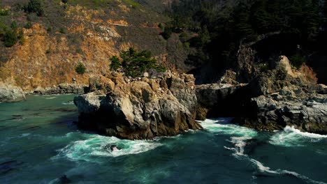 drone shot of waves crashing on scenic coastline at big sur state park off pacific coast highway in california 7