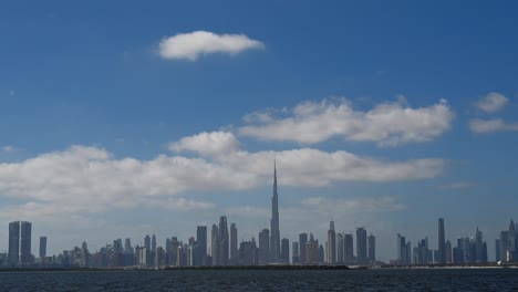 4k dubai time-lapse - urban skyline and modern skyscrapers in dubai on a cloudy winter day