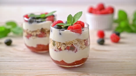 homemade raspberry and blueberry with yogurt and granola - healthy food style