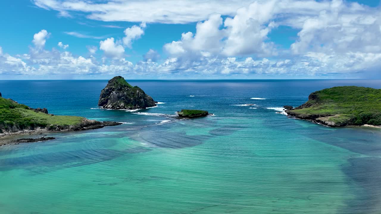 Seaside scenic vulcan mountain and beach at archipelago of Fernando de Noronha Brazil. Tropical islands at Fernando de Noronha archipelago. Vacation travel. Tropical destination.