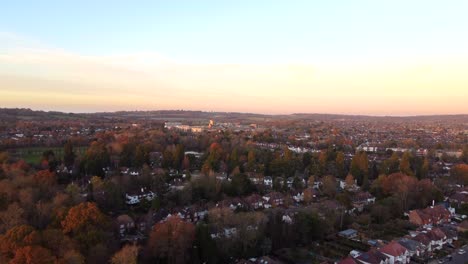 Beautiful-aerial-shot-of-a-British-suburban-town-in-autumn-at-sunset