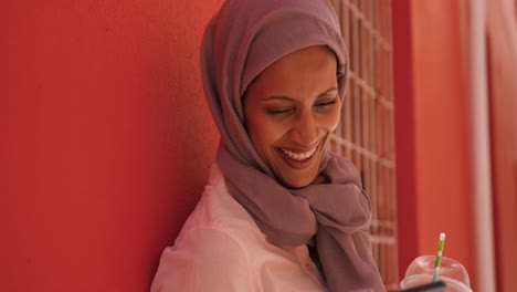 Young woman wearing hijab out and about in the city