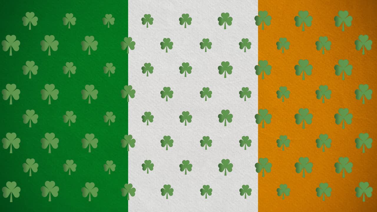 Animazione digitale di molteplici foglie di trifoglio che si muovono contro la bandiera irlandese.