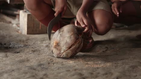 Peeling-Coconut-For-Making-a-Coconut-Milk-Traditional-making-a-coconut-milk-Thailand