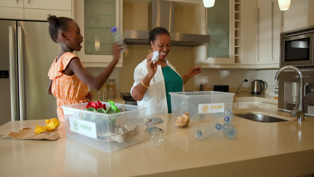 Sorting recyclables in kitchen, grandmother and child engaging in eco-friendly activity