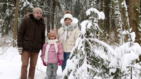family portrait in a snowy forest