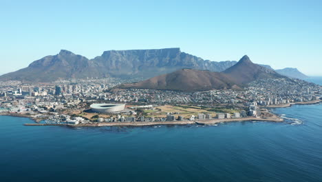 scenic view of cape town port city, table mountain, lion's head, and cape town stadium in south africa