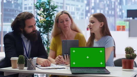 consultant uses financial planning software on chroma key notebook