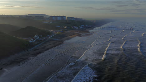 establishing drone shot of saltburn-by-the-sea looking up the coast towards redcar