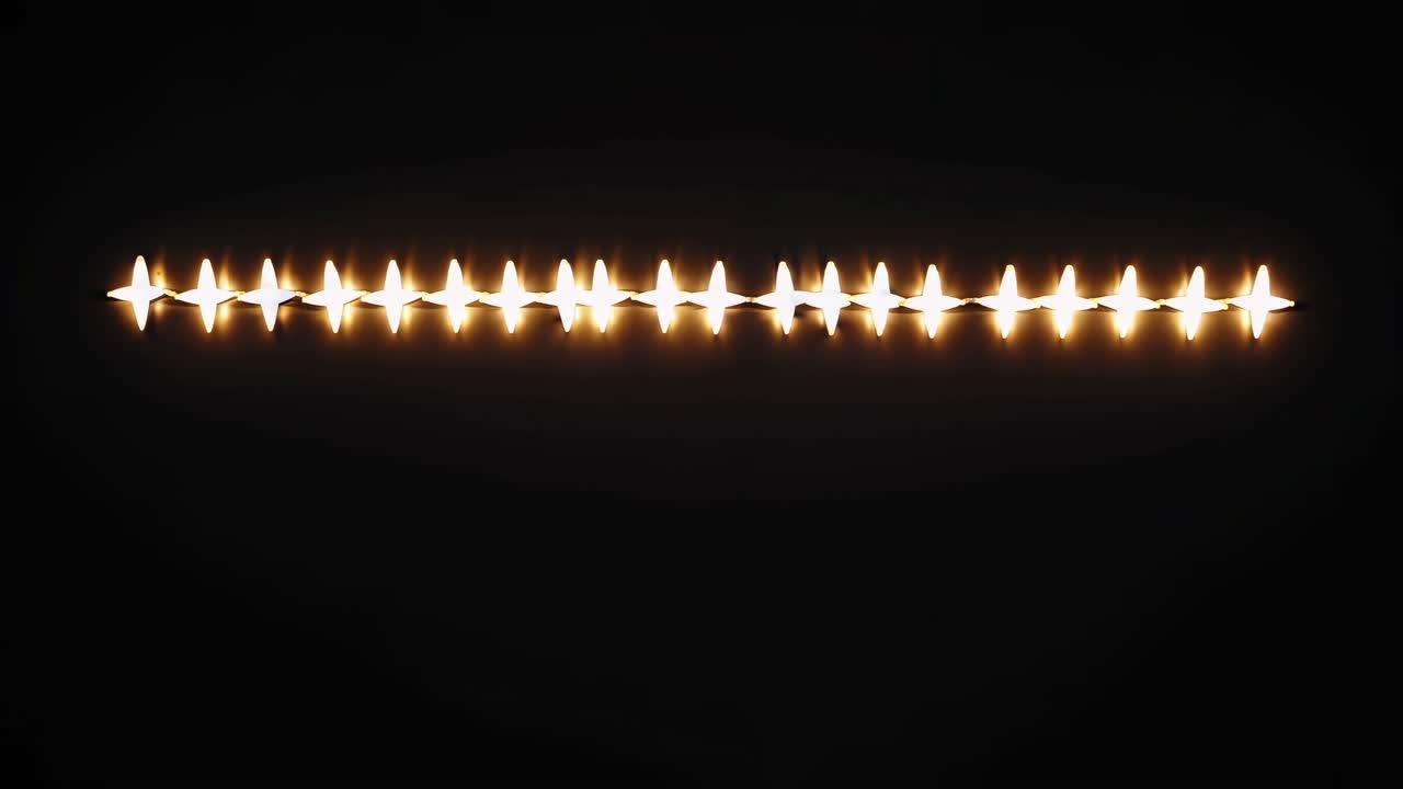 A row of candles in a dark setting, captured from a low-angle perspective, creating a serene